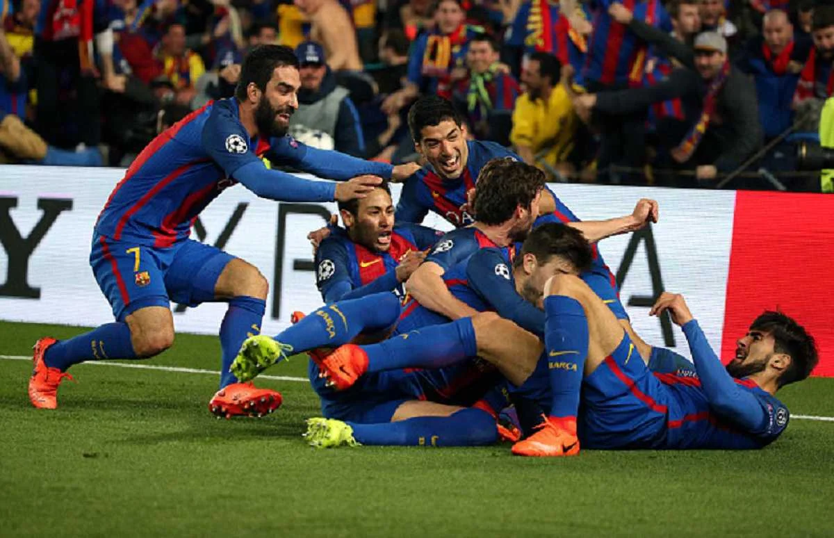Туран (зліва) щасливий у Барселоні / Getty Images