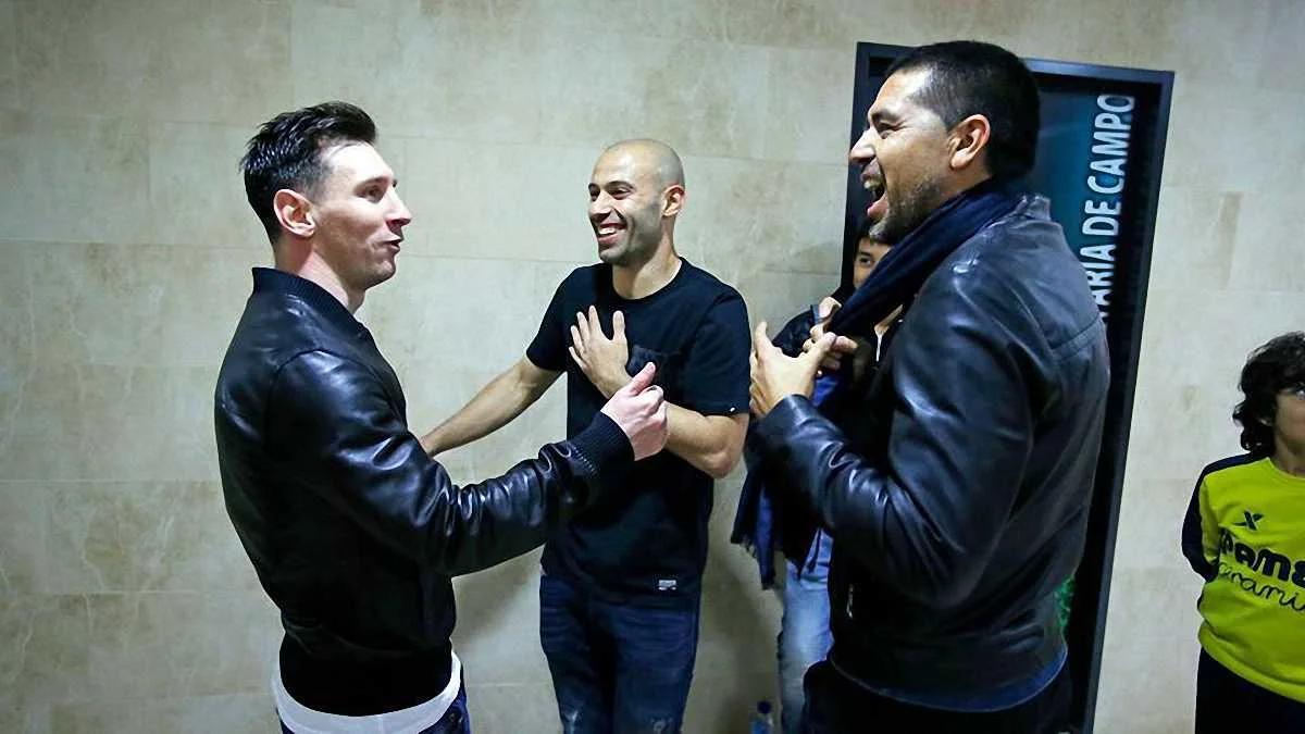 Хуан Роман Рікельме з Лео Мессі