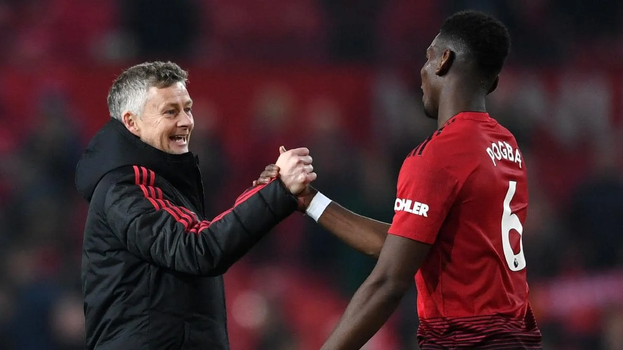 Уле Гуннар Сульшер та Поль Погба / Фото АР