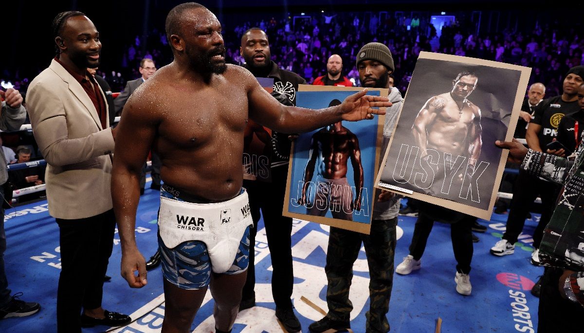 Дерек Чісора з портретом Олександра Усика / Getty Images