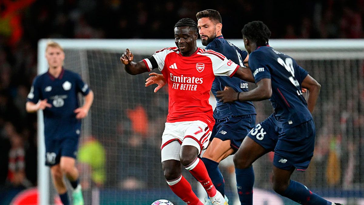 Букайо Сака и Оливье Жиру / Stuart MacFarlane/Arsenal FC via Getty Images
